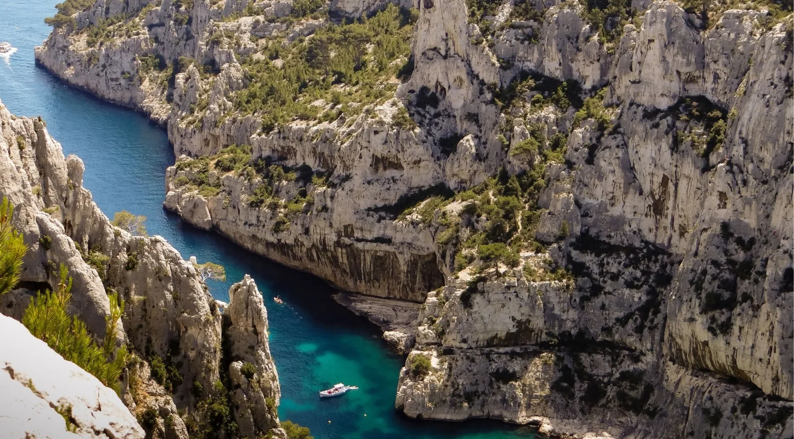 Calanque d'En-Vau viewed from above — narrow fjord between soaring white cliffs